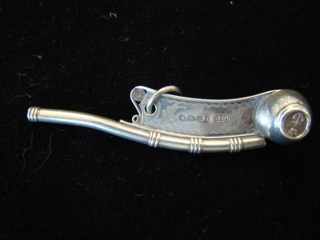A fine engraved Antique sterling silver boatswain's whistle by George Unite, London 1879